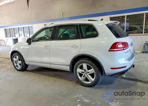 2013 Volkswagen Touareg Hybrid z USA, uszkodzony, nr VIN WVGEG9BP6DD001499